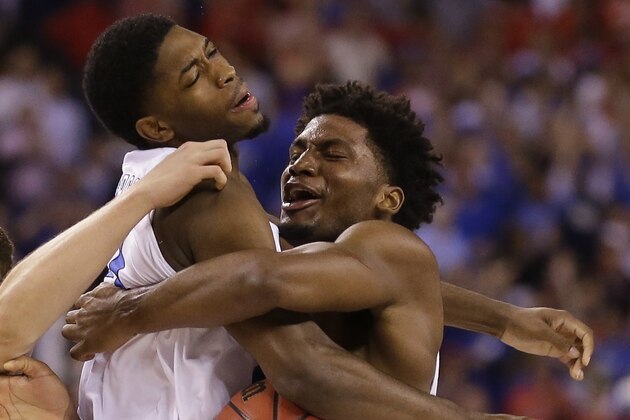 Duke's Amile Jefferson, left, and Justise Winslow celebrate after their team's 68-63 victory over Wisconsin in the NCAA Final Four college basketball tournament championship game Monday, April 6, 2015, in Indianapolis. (AP Photo/Michael Conroy)