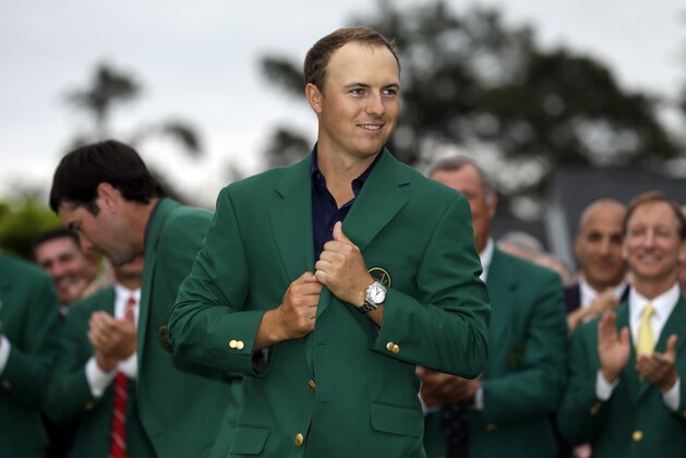 Jordan Spieth wears his green jacket after winning the Masters golf tournament Sunday, April 12, 2015, in Augusta, Ga. (AP Photo/David J. Phillip)