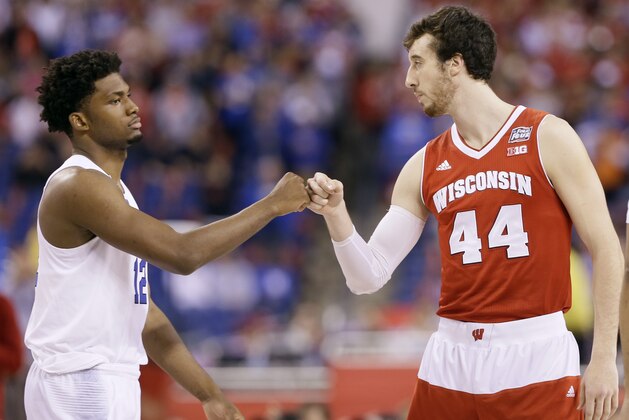 Duke's Justise Winslow, left, greets Wisconsin's Frank Kaminsky at the start of the NCAA Final Four college basketball tournament championship game Monday, April 6, 2015, in Indianapolis. (AP Photo/Charlie Neibergall)