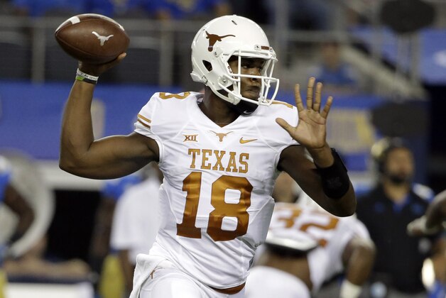 Texas quarterback Tyrone Swoopes passes against UCLA during the first half of an NCAA college football game, Saturday, Sept. 13, 2014, in Arlington, Texas. (AP Photo/Tony Gutierrez)