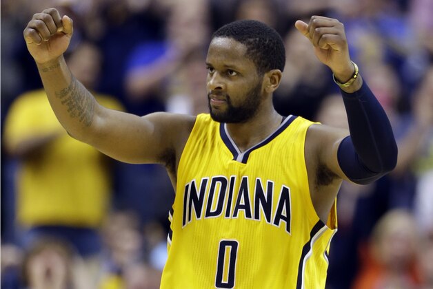 Indiana Pacers guard C.J. Miles celebrates during the second overtime period of an NBA basketball game against the Washington Wizards in Indianapolis, Tuesday, April 14, 2015. The Pacers defeated the Wizards 99-95 in double overtime. (AP Photo/Michael Conroy)