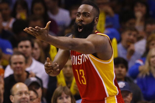 Houston Rockets guard James Harden (13) gestures to an official during an NBA basketball game between the Houston Rockets and the Oklahoma City Thunder in Oklahoma City, Sunday, April 5, 2015. Houston won 115-112. (AP Photo/Sue Ogrocki)