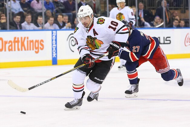Mar 18, 2015; New York, NY, USA; Chicago Blackhawks left wing Patrick Sharp (10) skates with the puck on a breakaway during the third period at Madison Square Garden.  The Blackhawks defeated the Rangers 1-0.  Mandatory Credit: Ed Mulholland-USA TODAY Sports