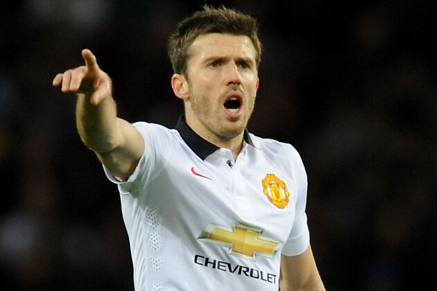 Manchester United's Michael Carrick during the English Premier League soccer match between Aston Villa and Manchester United at Villa Park, in  Birmingham, England, Saturday, Dec. 20, 2014.  (AP Photo/Rui Vieira)