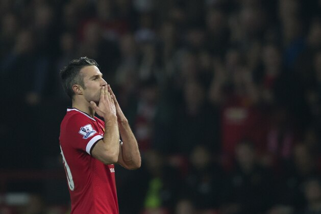 Manchester United's Robin van Persie celebrates after scoring during the English Premier League soccer match between Manchester United and Hull City at Old Trafford Stadium, Manchester, England, Saturday Nov. 29, 2014. (AP Photo/Jon Super)