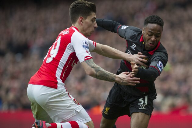 Arsenal's Héctor Bellerín, vies with Liverpool's Raheem Sterling, during their English Premier League soccer match, at Emirates Stadium, in London, Saturday, April 4, 2015. (AP Photo/Bogdan Maran) Arsenal's Héctor Bellerín, vies with Liverpool's Raheem Sterling, during their English Premier League soccer match, at Emirates Stadium, in London, Saturday, April 4, 2015. (AP Photo/Bogdan Maran)
