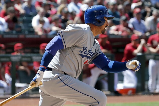 Los Angeles Dodgers' Adrian Gonzalez hits an infield grounder during the third inning of a baseball game against the Arizona Diamondbacks Sunday, April 12, 2015, in Phoenix. (AP Photo/Ross D. Franklin) Los Angeles Dodgers' Adrian Gonzalez hits an infield grounder during the third inning of a baseball game against the Arizona Diamondbacks Sunday, April 12, 2015, in Phoenix. (AP Photo/Ross D. Franklin)