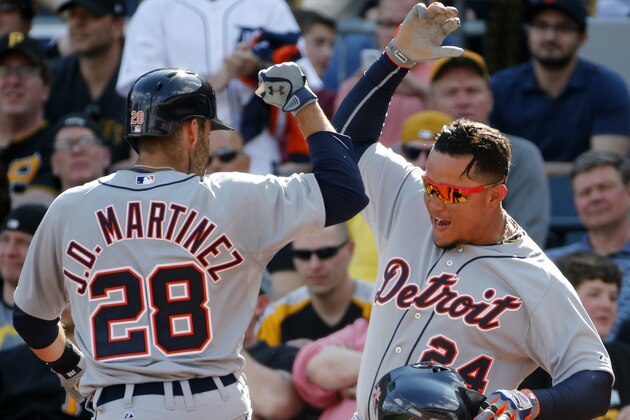 Detroit Tigers' J.D. Martinez (28) celebrates with Miguel Cabrera (24) after hitting a two-run home run off Pittsburgh Pirates closer  Mark Melancon during the ninth inning of a baseball game against the Pittsburgh Pirates in Pittsburgh Monday, April 13, 2015. The Pirates won 5-4. (AP Photo/Gene J. Puskar)