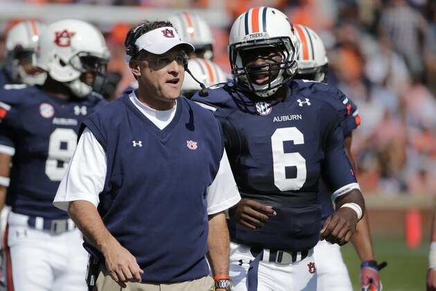 Auburn head coach Gus Malzahn talks with Auburn quarterback Jeremy Johnson (6) in the first half of an NCAA college football game in Auburn, Ala., Saturday, Oct. 12, 2013. (AP Photo/Dave Martin)