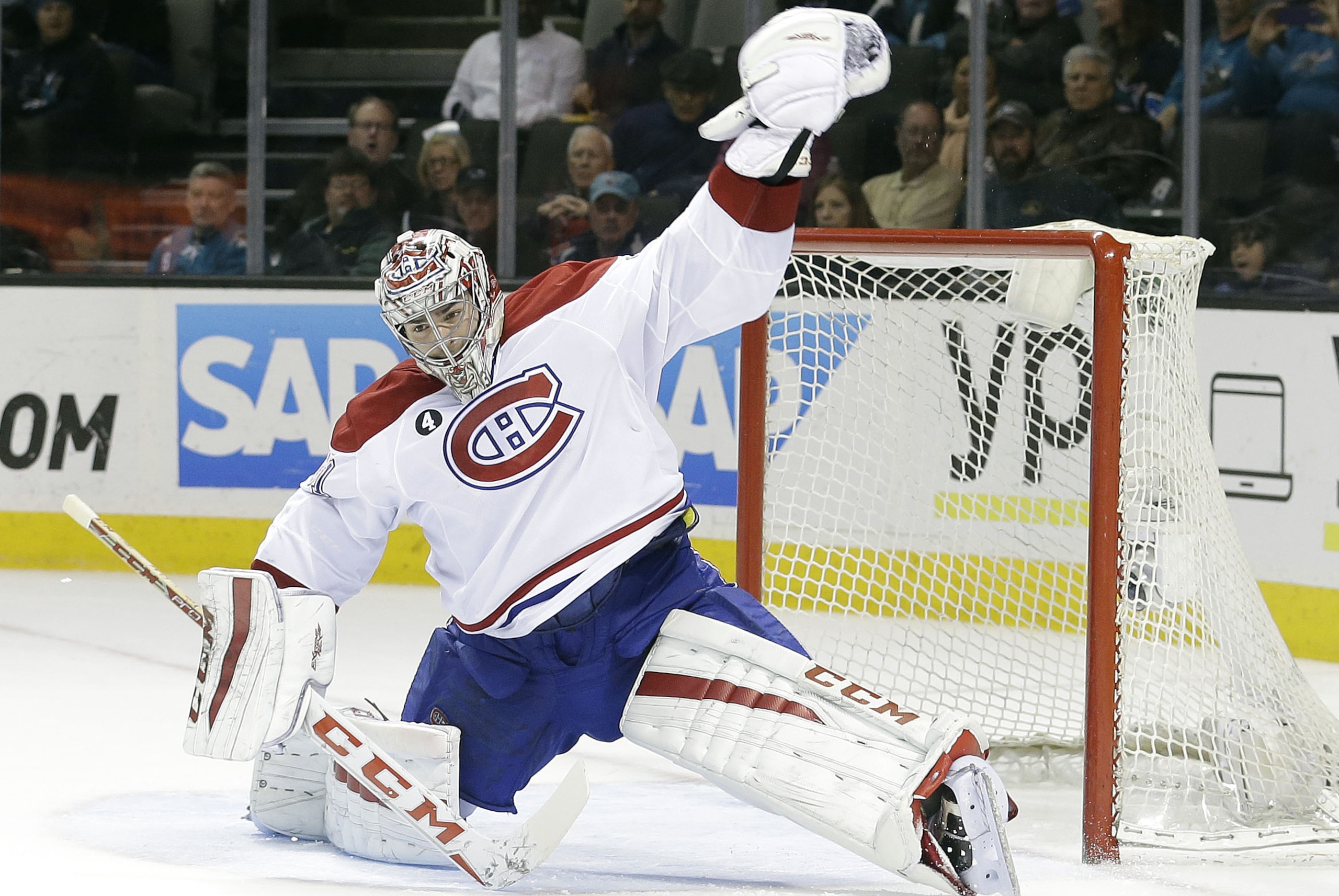Montreal Canadiens goalie Carey Price makes a save against the San Jose Sharks during the third period of an NHL hockey game Monday, March 2, 2015, in San Jose, Calif. San Jose won 4-0. (AP Photo/Marcio Jose Sanchez)