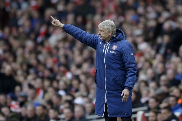 Arsenal's French manager Arsene Wenger gestures from the sidelines during the English Premier League soccer match between Arsenal and West Ham United at the Emirates Stadium in London, Saturday, March 14, 2015.  (AP Photo/Matt Dunham)