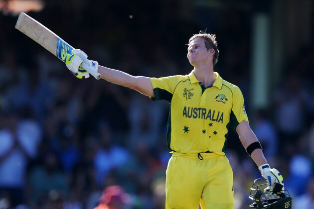 Australia's Steve Smith celebrates after scoring  a century while batting against India during their Cricket World Cup semifinal in Sydney, Australia, Thursday, March 26, 2015. (AP Photo/Rick Rycroft)