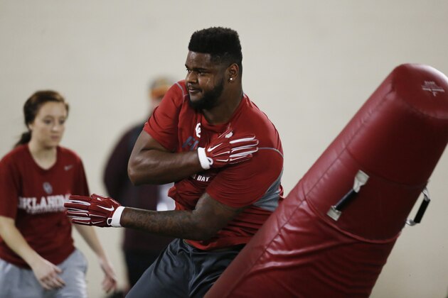 Oklahoma defensive tackle Jordan Phillips works out for NFL scouts during Oklahoma Pro Day in Norman, Okla., Wednesday, March 11, 2015. (AP Photo/Sue Ogrocki)