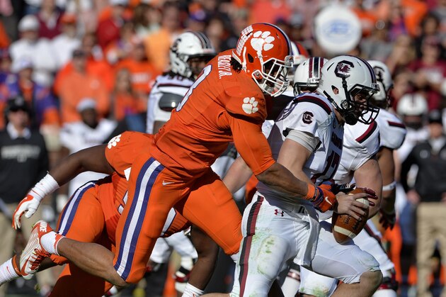 South Carolina quarterback Dylan Thompson is sacked by Clemson's Vic Beasley during the second half of an NCAA college football game in Clemson, S.C., Saturday, Nov. 29, 2014. (AP Photo/Richard Shiro)