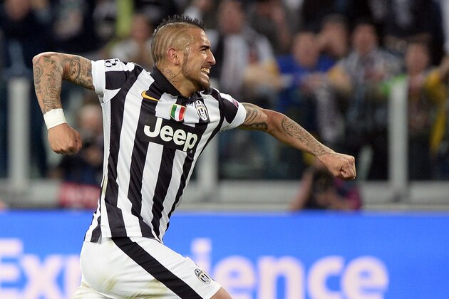 Juventus' Arturo Vidal celebrates after scoring his side's first goal during the Champions League, quarterfinal, first leg soccer match between Juventus and Monaco, at the Juventus Stadium in Turin, Italy, Tuesday, April 14, 2015. (AP Photo/Massimo Pinca)