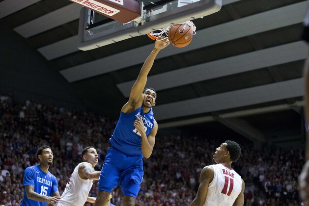 Kentucky forward Karl-Anthony Towns (12) dunks as Alabama's Michael Kessen, second from left, and Shannon Hale (10) look on during the first half of an NCAA college basketball game, Saturday, Jan. 17, 2015, in Tuscaloosa, Ala. (AP Photo/Brynn Anderson)
