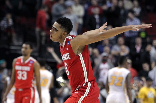 Ohio State guard D'Angelo Russell races toward his teammates after the buzzer in overtime in an NCAA college basketball second-round game against Virginia Commonwealth in Portland, Ore., Thursday, March 19, 2015. Ohio State  won 75-72. (AP Photo/Craig Mitchelldyer)