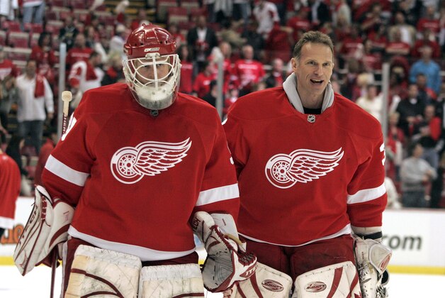 Detroit Red Wings goalies Chris Osgood, left, and Dominik Hasek are seen after the second period of Game 1 against the Dallas Stars of the Western Conference hockey finals in Detroit, Thursday, May 8, 2008.  (AP Photo/Jerry Mendoza)