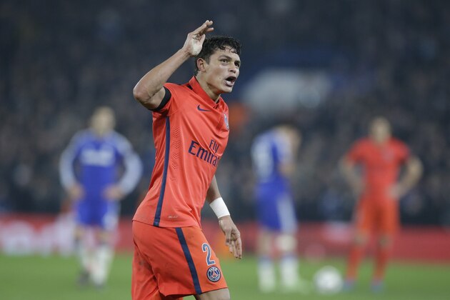PSG's Thiago Silva celebrates after scoring his side's second goal during the Champions League round of 16 second leg soccer match between Chelsea and Paris Saint Germain at Stamford Bridge stadium in London, Wednesday, March 11, 2015. (AP Photo/Matt Dunham)