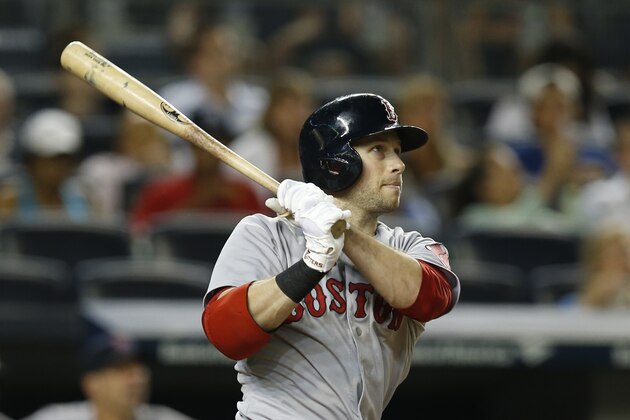 Boston Red Sox Daniel Nava watches his third-inning, three-run, home run in a baseball game at Yankee Stadium in New York, Tuesday, Sept. 2, 2014.  (AP Photo/Kathy Willens)