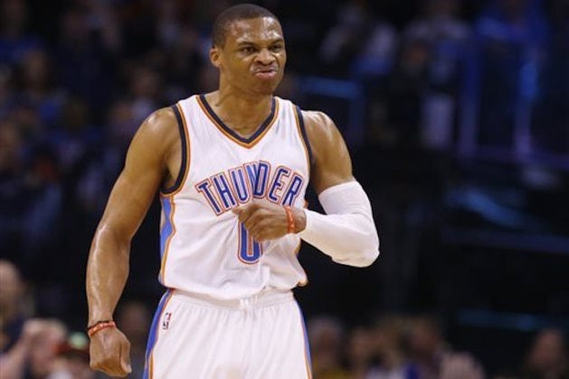 Oklahoma City Thunder guard Russell Westbrook reacts after hitting a 3-point shot during the first quarter of an NBA basketball game against the Portland Trail Blazers in Oklahoma City, Monday, April 13, 2015. (AP Photo/Sue Ogrocki)