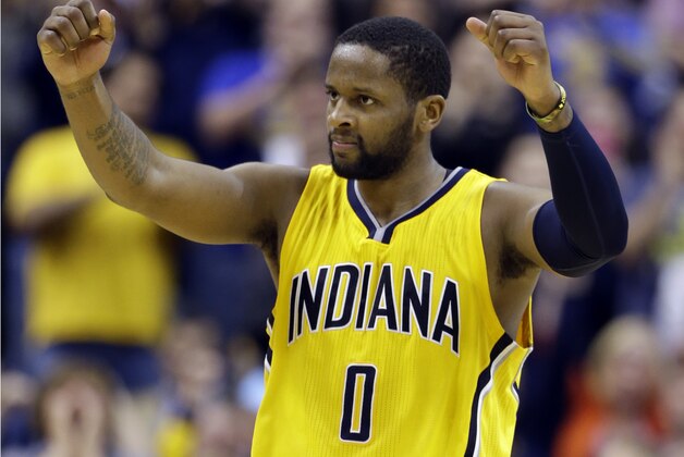 Indiana Pacers guard C.J. Miles celebrates during the second overtime period of an NBA basketball game against the Washington Wizards in Indianapolis, Tuesday, April 14, 2015. The Pacers defeated the Wizards 99-95 in double overtime. (AP Photo/Michael Conroy)