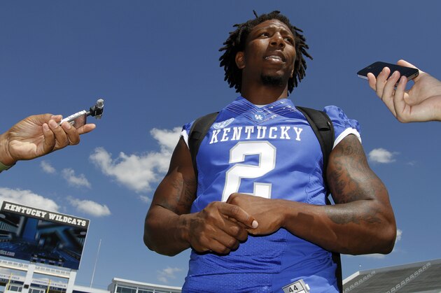 Alvin Dupree speaks with reporters during Kentucky's NCAA college football's media day at Commonwealth Stadium in Lexington, Ky., Monday, Aug. 5, 2013. (AP Photo/James Crisp)