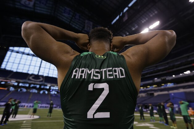 Orgegon defensive lineman Arik Armstead stretches before drills at the NFL football scouting combine in Indianapolis, Sunday, Feb. 22, 2015. (AP Photo/Julio Cortez)