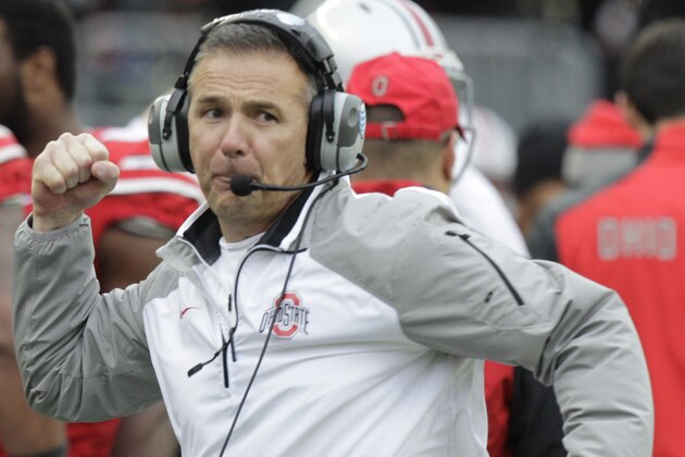 Ohio State head coach Urban Meyer reacts to an Ohio State touchdown against Michigan during the fourth quarter of an NCAA college football game Saturday, Nov. 29, 2014, in Columbus, Ohio. Ohio State beat Michigan 42-28. (AP Photo/Jay LaPrete)
