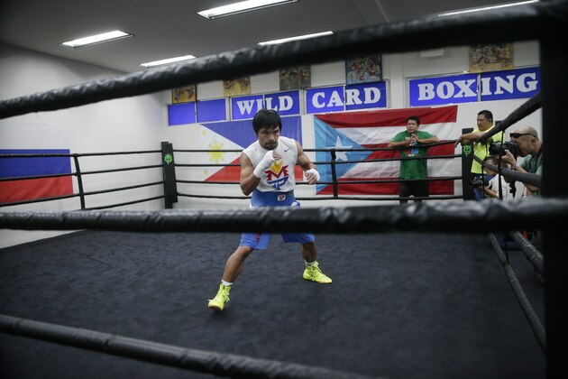 Boxer Manny Pacquiao, of the Philippines, shadow-boxes during his workout, Monday, April 13, 2015, in Los Angeles. Pacquiao will face Floyd Mayweather Jr. in a welterweight boxing match in Las Vegas on May 2. (AP Photo/Jae C. Hong)