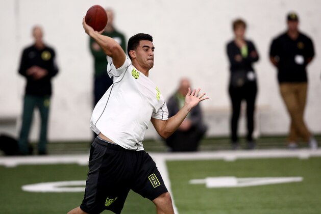 Oregon's Marcus Mariota works out for NFL football scouts during Pro Day at the University of Oregon, Thursday, March 12, 2015, in Eugene, Ore. (AP Photo/Ryan Kang)