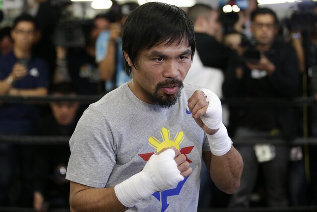 Boxer Manny Pacquiao, of the Philippines, shadow-boxes during a media workout at Wild Card Boxing Club, Wednesday, April 15, 2015, in Los Angeles. Pacquiao is scheduled to fight Floyd Mayweather Jr. in a welterweight boxing match in Las Vegas on May 2. (AP Photo/Jae C. Hong)