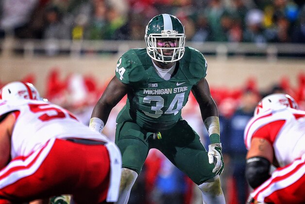 Oct 4, 2014; East Lansing, MI, USA; Michigan State Spartans linebacker Taiwan Jones (34) looks over Nebraska Cornhuskers offense during the 1st half of a game at Spartan Stadium. Mandatory Credit: Mike Carter-USA TODAY Sports
