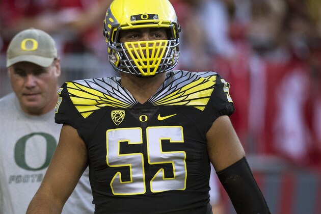 Oregon center Hroniss Grasu (55) warms up before the start of an NCAA college football game against Washington State on Saturday, Sept. 20, 2014, at Martin Stadium in Pullman, Wash. Oregon won 38-31. (AP Photo/Dean Hare)