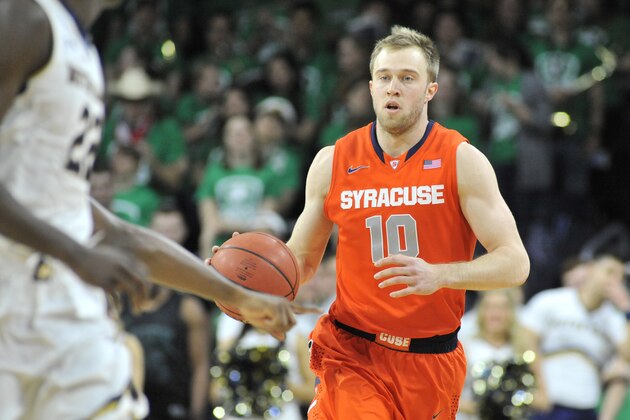 Syracuse guard Trevor Cooney dribbles up court in an NCAA college basketball game Tuesday Feb. 24, 2015 in South Bend, Ind. (AP Photo/Joe Raymond)