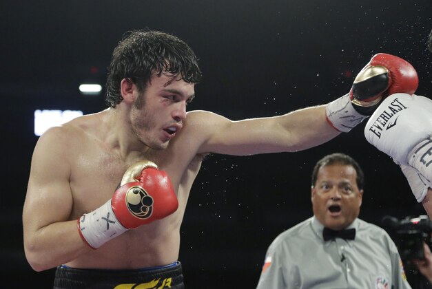 Julio Cesar Chavez Jr., left, and Bryan Vera, right, during a 12-round super middleweight bout, Saturday, March 1, 2014, in San Antonio. Chavez won by decision. (AP Photo/Eric Gay)