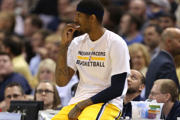 Apr 14, 2015; Indianapolis, IN, USA; Indiana Pacers forward Paul George (13) waits to check into a game against the Washington Wizards at Bankers Life Fieldhouse. Indiana defeats Washington 99-95 in double overtime. Mandatory Credit: Brian Spurlock-USA TODAY Sports