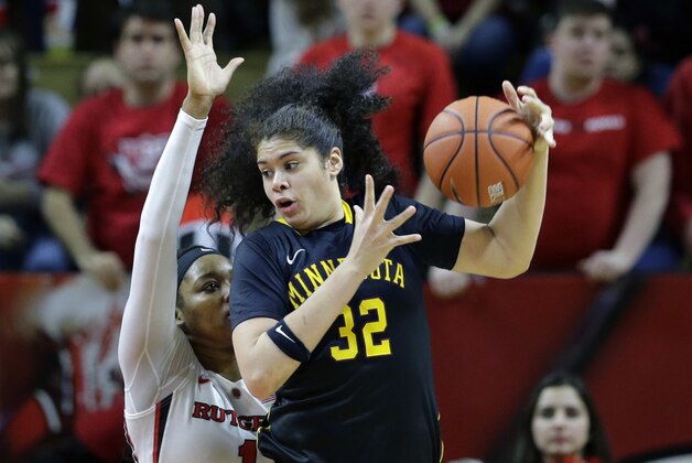 Minnesota center Amanda Zahui B. (32), of Sweden, tries to control the ball as Rutgers center Rachel Hollivay (1) defends during the second half of an NCAA college basketball game Sunday, Jan. 25, 2015, in Piscataway, N.J. Rutgers won 66-61. (AP Photo/Mel Evans)