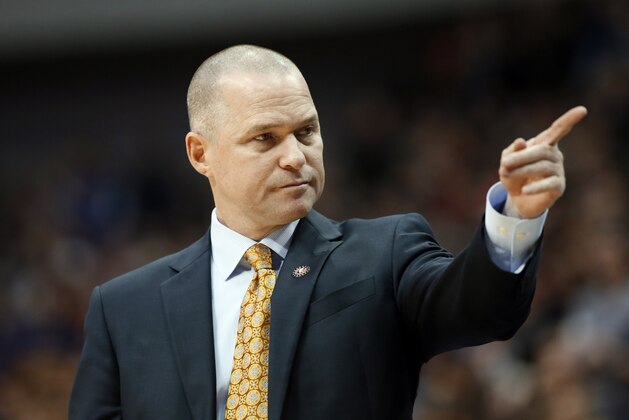 Sacramento Kings coach Michael Malone calls for a substitution late in the second half of an NBA basketball game against the Dallas Mavericks, Tuesday, Nov. 11, 2014, in Dallas. The Mavericks won 106-98.  (AP Photo/Tony Gutierrez)