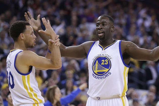 Golden State Warriors' Stephen Curry, left, and Draymond Green (23) gesture to referees after Green was called for a foul during the first half of an NBA basketball game against the Portland Trail Blazers on Thursday, April 9, 2015, in Oakland, Calif. (AP Photo/Ben Margot)