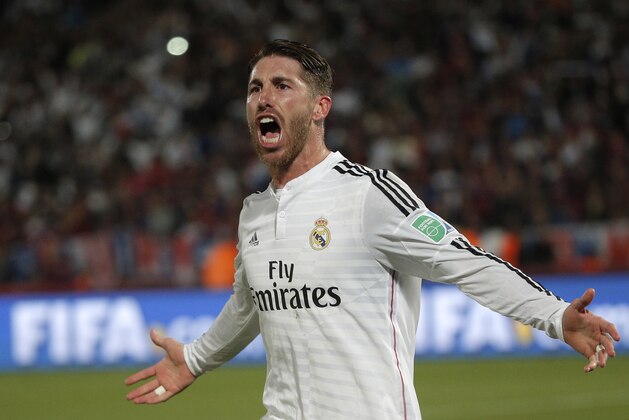 Real Madrid’s Sergio Ramos celebrates scoring the opening goal during the final soccer match between Real Madrid and San Lorenzo at the Club World Cup soccer tournament in Marrakech, Morocco, Saturday, Dec. 20, 2014. (AP Photo/Christophe Ena)