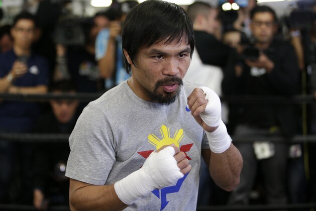 Boxer Manny Pacquiao, of the Philippines, shadow-boxes during a media workout at Wild Card Boxing Club, Wednesday, April 15, 2015, in Los Angeles. Pacquiao is scheduled to fight Floyd Mayweather Jr. in a welterweight boxing match in Las Vegas on May 2. (AP Photo/Jae C. Hong)