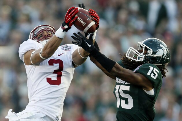 Michigan State cornerback Trae Waynes, right, intercepts a pass intended for Stanford wide receiver Michael Rector during the second half of the Rose Bowl NCAA college football game on Wednesday, Jan. 1, 2014, in Pasadena, Calif. (AP Photo/Danny Moloshok)
