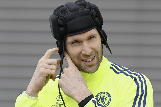 Chelsea's goalkeeper Petr Cech arrives for a training session at the training ground in Cobham, England, Monday, Feb. 16, 2014. Chelsea will play Paris Saint Germain in a Champions League knock out round of sixteen in Paris on Tuesday. (AP Photo/Kirsty Wigglesworth)