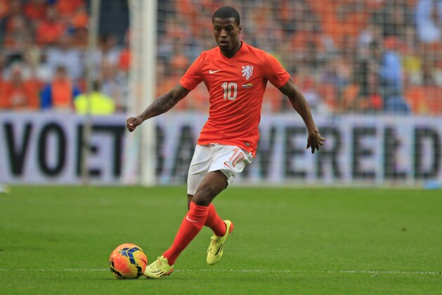 Netherlands' Georginio Wijnaldum plays the ball during the international friendly soccer match between Netherlands and Ecuador at ArenA stadium in Amsterdam, Netherlands, Saturday, May 17, 2014. (AP Photo/Peter Dejong)