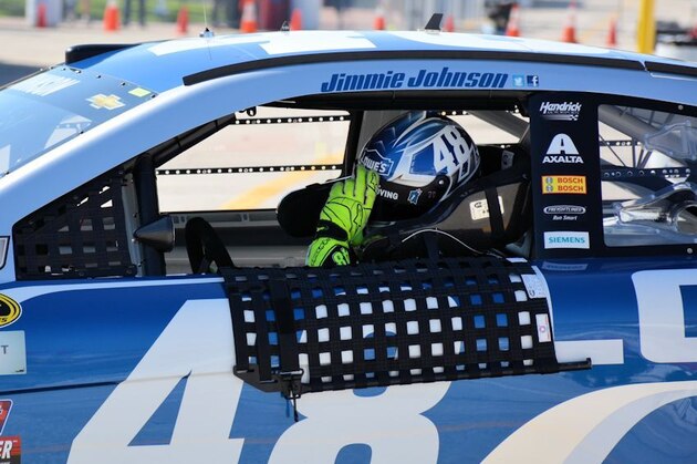 Jimmie Johnson adjusts visor after a practice run at Daytona International Speedway.