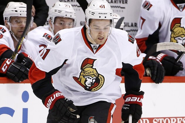 Ottawa Senators' Mark Stone (61) gains control of the puck against the Arizona Coyotes during the first period of an NHL hockey game Saturday, Jan. 10, 2015, in Glendale, Ariz.  (AP Photo/Ross D. Franklin)