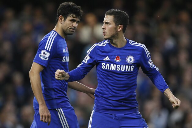 Chelsea's Eden Hazard, right, celebrates with teammate Diego Costa after scoring a goal  during the English Premier League soccer match between Chelsea and Queens Park Rangers at Stamford Bridge Stadium in London, Saturday, Nov. 1, 2014. (AP Photo/Kirsty Wigglesworth)