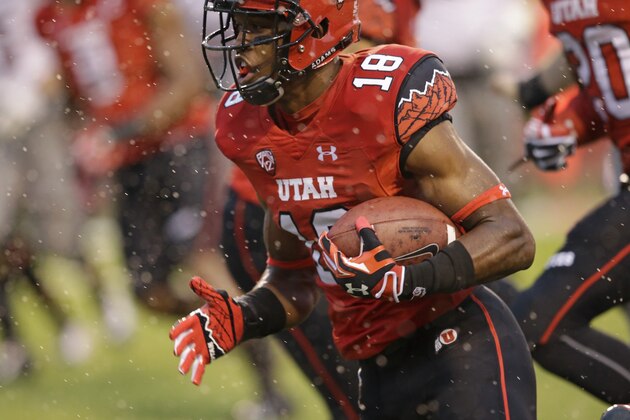 Utah defensive back Eric Rowe (18) carries the ball following an interception against Washington State in the first quarter during an NCAA college football game Saturday, Sept. 27, 2014, in Salt Lake City. (AP Photo/Rick Bowmer)