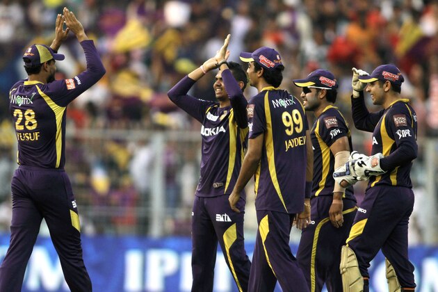 Sunil Narine, second left without cap, of Kolkata Knight Riders is congratulated by teammates after claiming five wickets during their Indian Premier League (IPL) cricket match against Kings XI Punjab in Kolkata, India, Sunday, April 15, 2012. (AP Photo/Bikas Das)